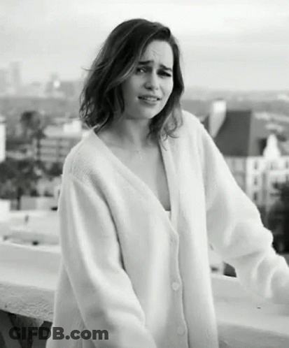 Woman In White Sweater On Balcony GIF
