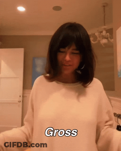 Woman In White Sweater Saying Gross GIF