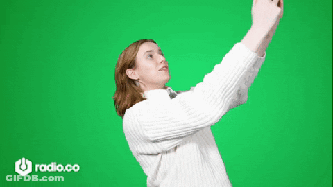 Woman In White Sweater Taking Selfie GIF