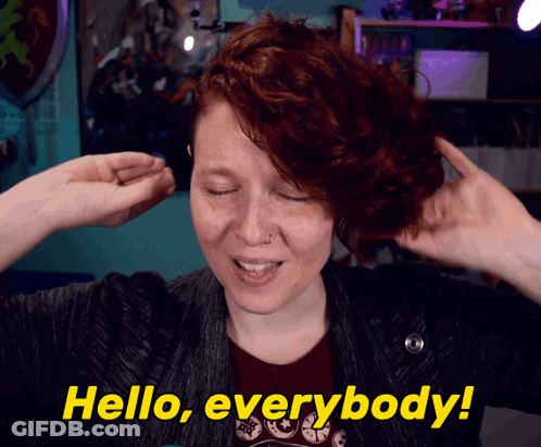 Woman In White Sweater With Gel Name Tag GIF
