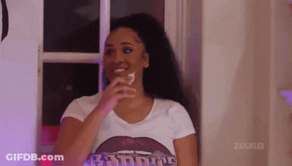 Woman In White T-Shirt Holding Glass Of Water By Window GIF