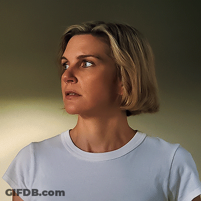 Woman In White T-Shirt Looking To The Side GIF