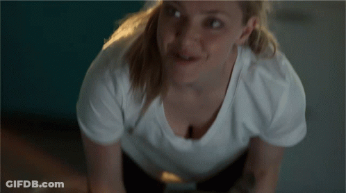 Woman In White T-Shirt Smiling At Camera GIF