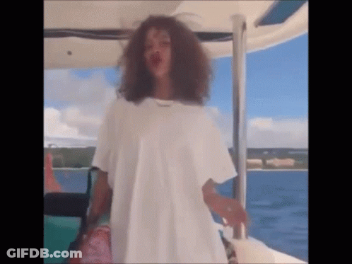 Woman In White T-Shirt Standing On Boat GIF