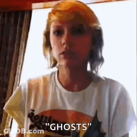 Woman In White T-Shirt Talking About Ghosts GIF