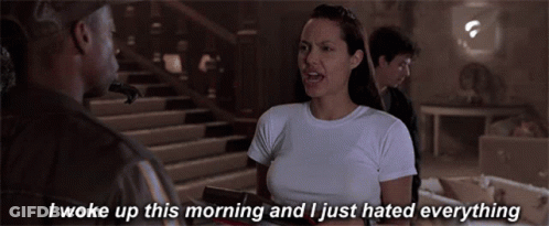 Woman In White T-Shirt Talks To Man Dark GIF