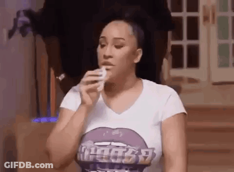 Woman In White T-Shirt With Purple Lip Holding Ponytail GIF