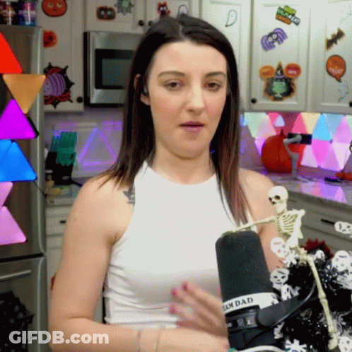 Woman In White Tank Top At Sandad Microphone GIF