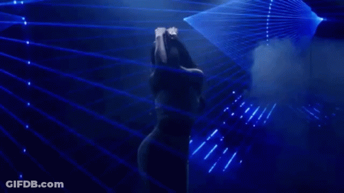 Woman In White Tank Top Dancing On Stage GIF