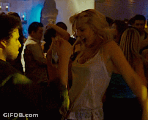 Woman In White Tank Top Holding Bottle Of Alcohol GIF