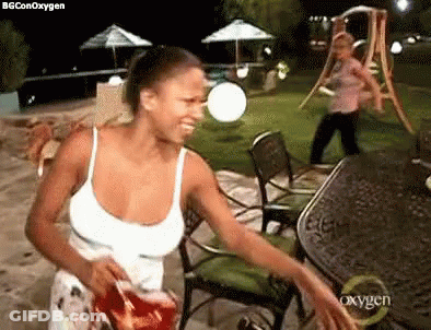Woman In White Tank Top Holding Chips GIF
