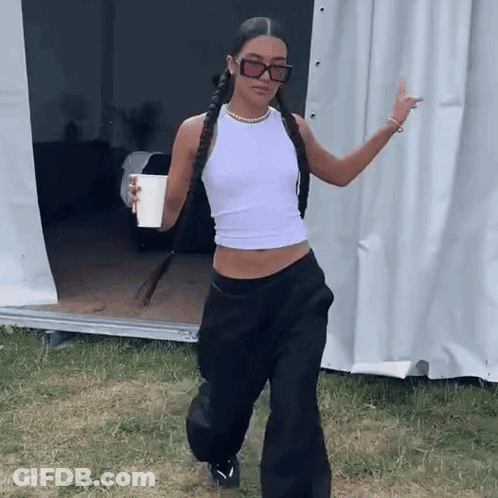 Woman In White Tank Top Holding Coffee GIF