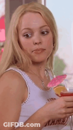 Woman In White Tank Top Holding Drink With Umbrella GIF
