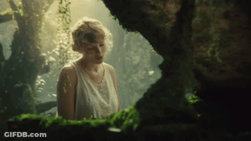 Woman In White Tank Top In Cave GIF