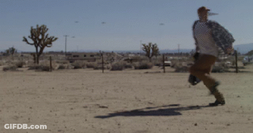 Woman In White Tank Top In Front Of 4Gifs.com Logo GIF