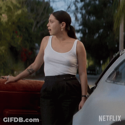 Woman In White Tank Top Next To Car With Netflix GIF