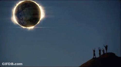 Woman In White Tank Top Next To Man In Baseball Cap GIF