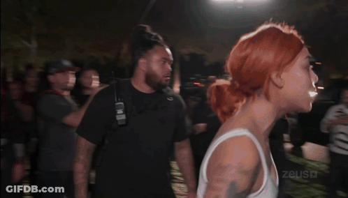 Woman In White Tank Top Punched By Man GIF