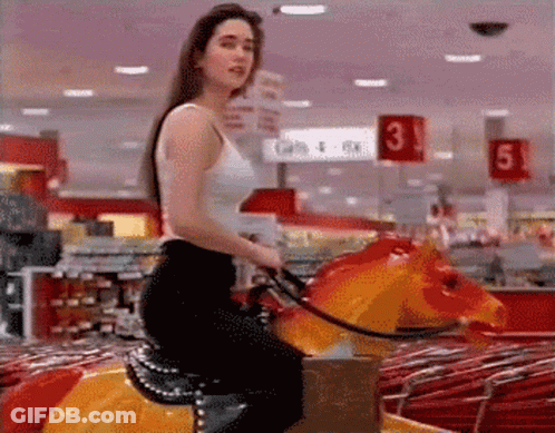 Woman In White Tank Top Riding Carousel Horse GIF