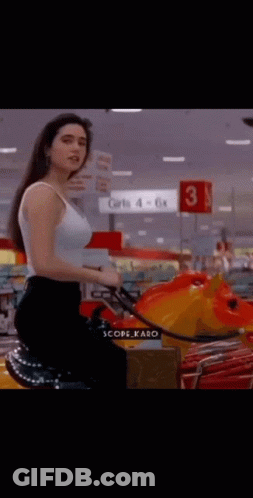 Woman In White Tank Top Riding Toy Horse GIF