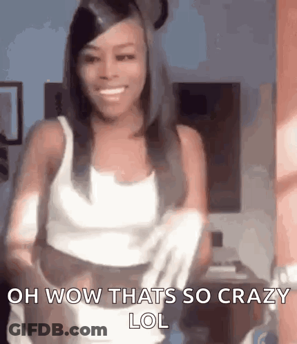 Woman In White Tank Top Smiling Holding Towel GIF