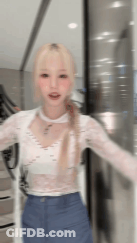 Woman In White Top Blue Pants At Glass Door GIF
