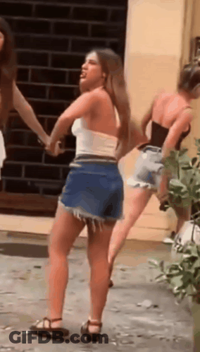 Woman In White Top Shorts Dancing With Two Women GIF