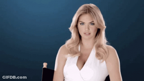 Woman In White Top Sitting In Director's Chair GIF