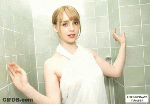 Woman In White Towel Leaning Against Green Tiled Wall With Cherrydmw Tumblr GIF