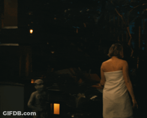 Woman In White Towel Walking Deck At Night GIF