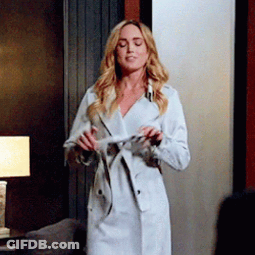 Woman In White Trench Coat GIF