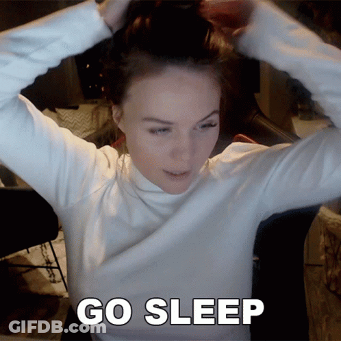 Woman In White Turtleneck Hair Bun Saying Go Sleep GIF