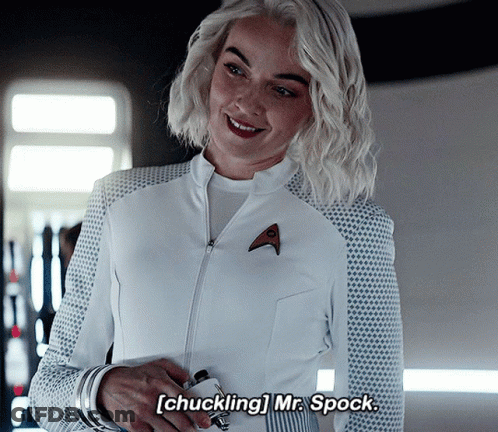 Woman In White Uniform Smiling Chuckling Mr. Spock GIF