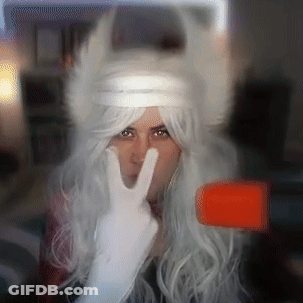 Woman In White Wig And White Gloves Giving Peace Sign GIF