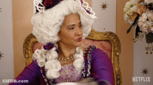 Woman In White Wig Sitting With Netflix Logo GIF