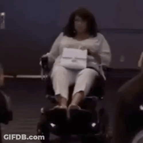Woman In Wig And Earrings Making Funny Face GIF