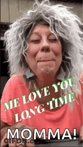 Woman In Wig And Earrings Says Me Love You Long Time Momma GIF
