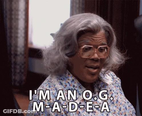 Woman In Wig And Glasses Saying I'm An O.G. M-A-D-E-A GIF