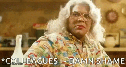 Woman In Wig And Glasses Says Colleagues Damn Shame GIF