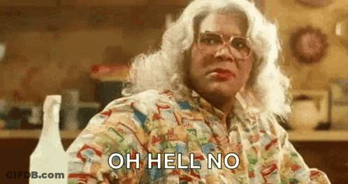 Woman In Wig And Glasses With Spray Bottle GIF