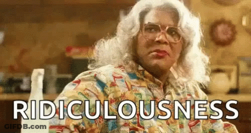 Woman In Wig And Glasses With Spray Bottle Ridiculousness GIF