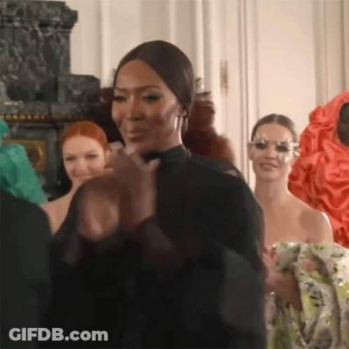 Woman In Wig And Purple Makeup Close Up GIF