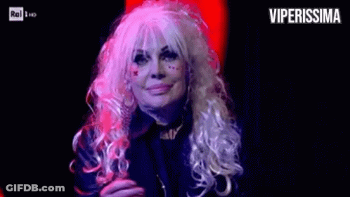 Woman In Wig Applauding On Stage GIF