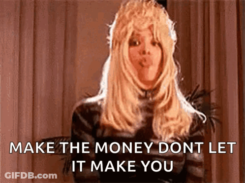 Woman In Wig Blowing Kiss Says Make The Money Don't Let It Make You GIF