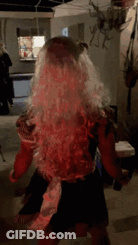 Woman In Wig Dancing In Dark Room GIF