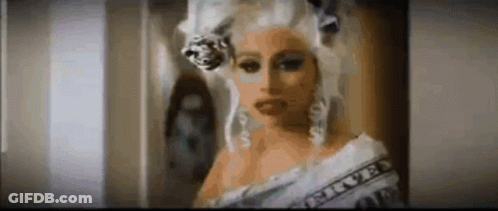 Woman In Wig Holding Money GIF