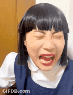 Woman In Wig Making Funny Face GIF