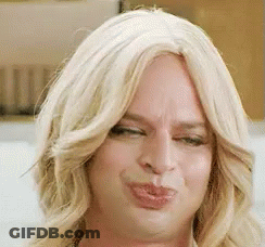 Woman In Wig Making Funny Face GIF