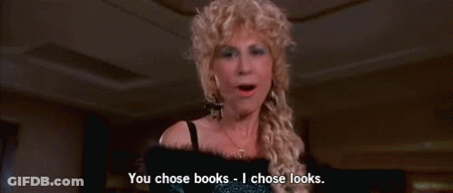 Woman In Wig Saying You Chose Books I Chose Looks GIF