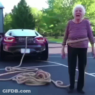 Woman In Wig Surprised Pink Curtain GIF